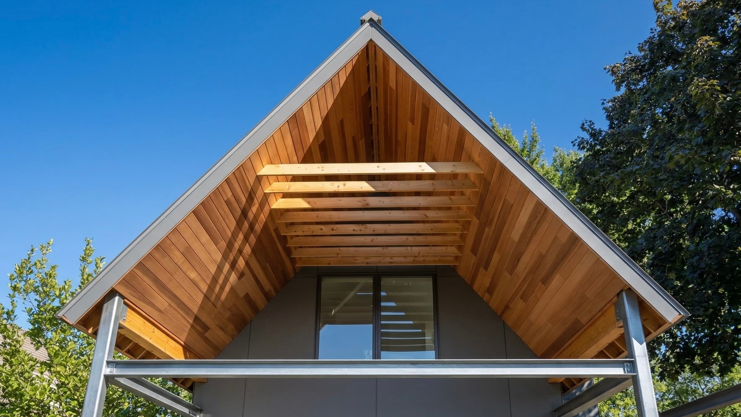 Cedar-lined gable canopy with exposed rafters over a second-storey window